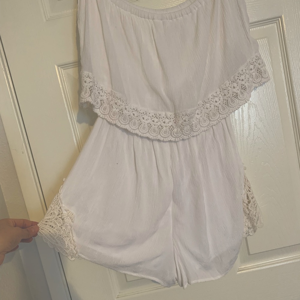 Ruffle sleeveless romper with crochet trim
